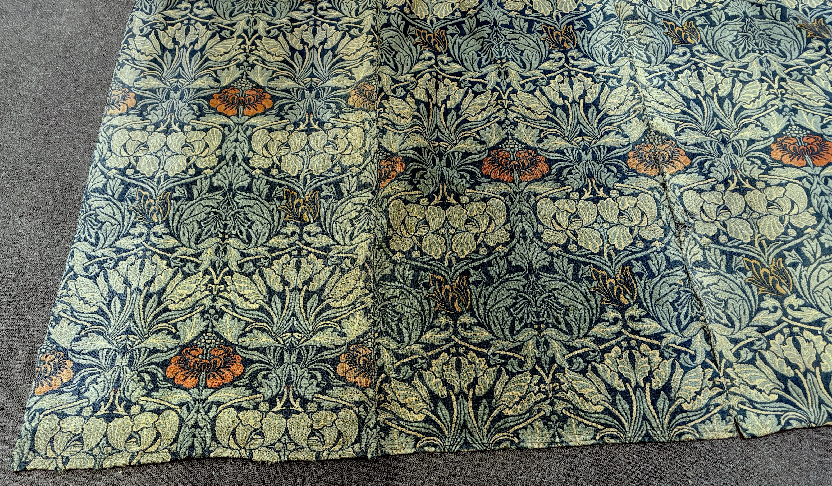 William Morris (1834-1896). Four panels of ‘Tulip and Rose’ triple woven wool and linen mix being two lengths sewn together creating a pair of wider curtains widest curtain (of two panels) 189cm wide x 158cm long, Single